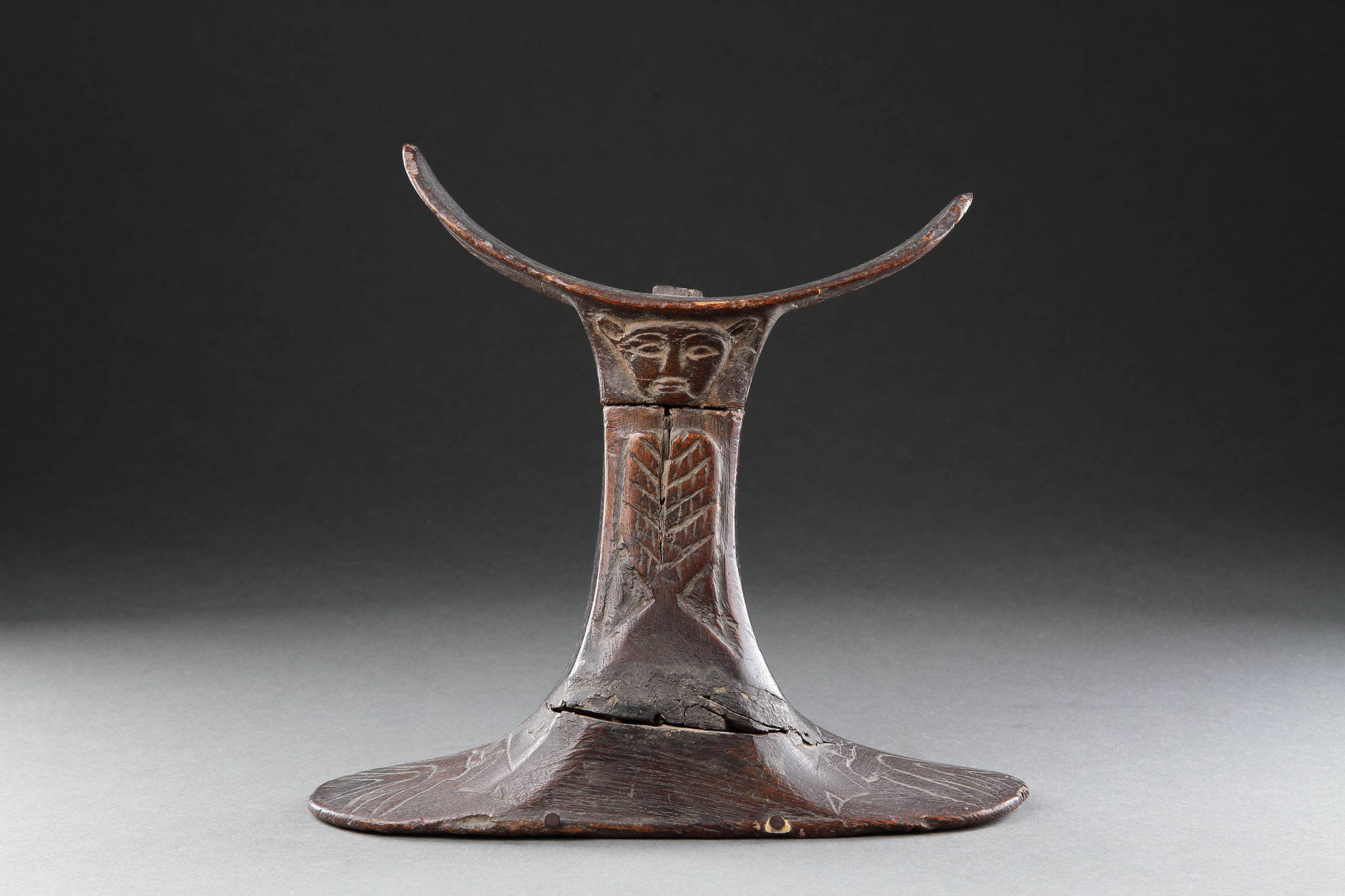 Rare and Finely Carved Egyptian Wooden Headrest with a Carved Head to both Sides Representing the God ‘Bes’